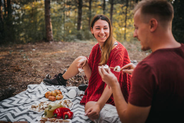 istock Young romantic couple enjoying campfire 1276703024