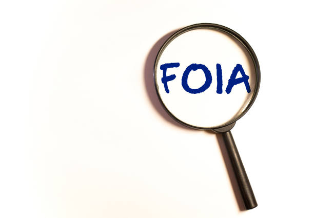 istock Paper with The Freedom of Information Act FOIA on a table 1276704202
