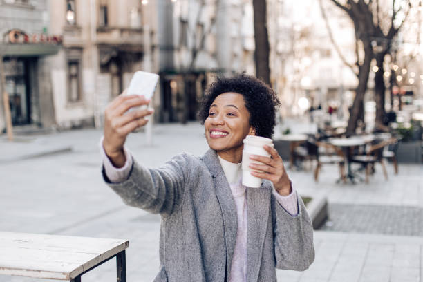 istock Cheerful woman showing the coffee 1276706575