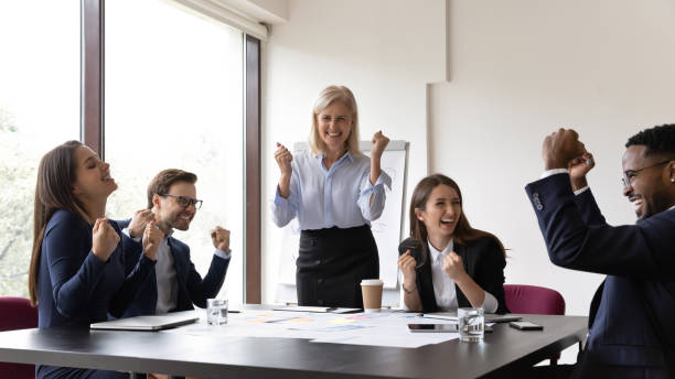 istock Overjoyed multiracial colleagues celebrate shared success at meeting 1276706792