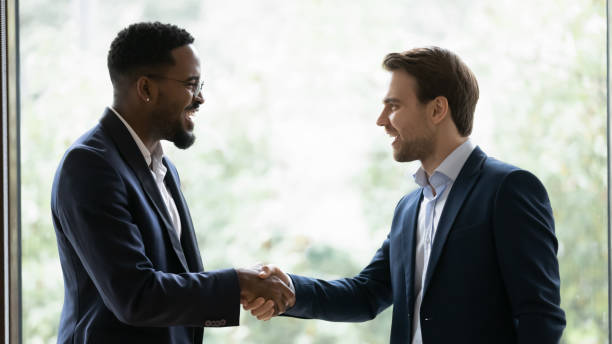 istock Happy multiracial businessmen handshake getting acquainted in office 1276706802