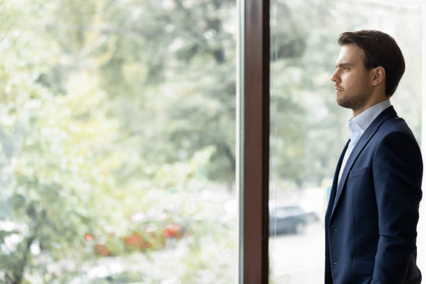 istock Serious businessman look in distance planning thinking 1276706823