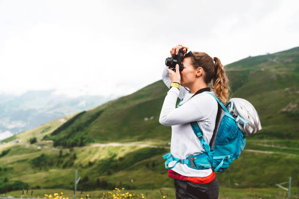 istock Woman hiker capturing moments in the mountains 1276706830