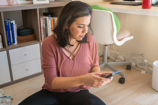 istock Latin woman working from home 1276719630