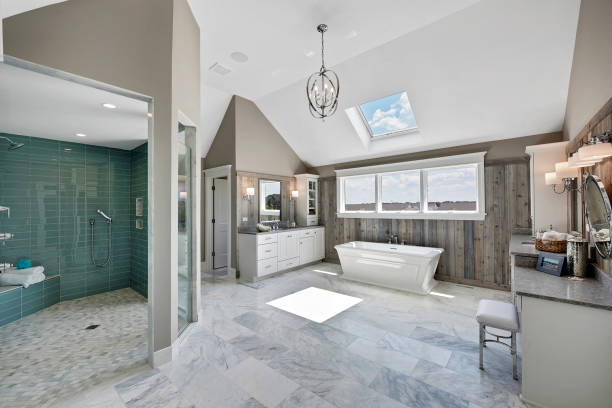 Spectacular walk-in shower in a spacious bathroom with skylights Large free standing tub and gorgeous shower are big enough for two people handle photos stock pictures, royalty-free photos & images