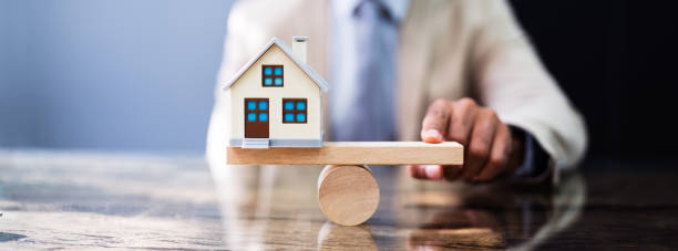 istock Wooden Seesaw House Balance 1276730921
