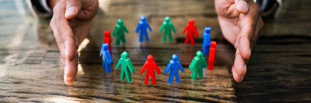 istock African Man Protecting Employee Figures 1276730936