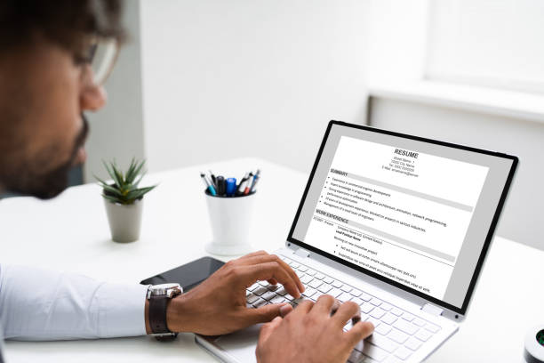 istock African American Reading Resume On Computer 1276731840