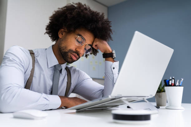 Restful Unhappy African Man Sleeping Restful Unhappy African Man Sleeping At Work narcolepsy stock pictures, royalty-free photos & images