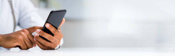 istock African Man Holding Smartphone 1276731914