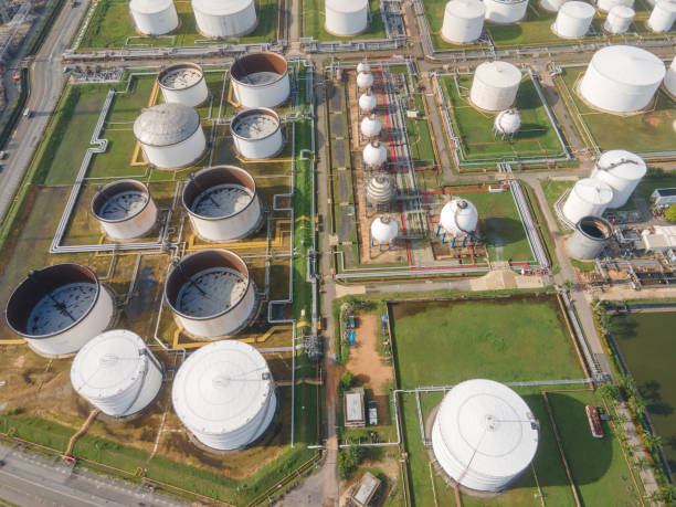 istock Oil refinery plant DRONE industrial factory building construction from engineering technology and steel material such as steel structure, metal, valve control, pipe, pipeline for transport oil and gas. 1276732216
