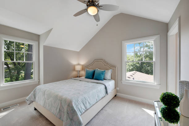 istock Vaulted ceiling in bedroom with dormer window 1276734260