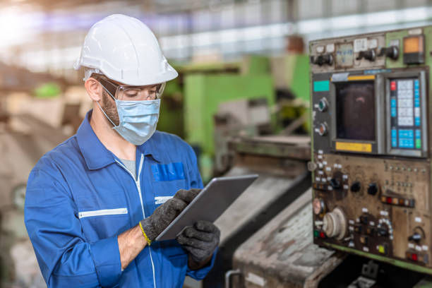 istock Worker wearing face shield or disposable face mask during working service in factory to prevent Coronavirus(Covid-19) or air dust pollution in factory. 1276735580