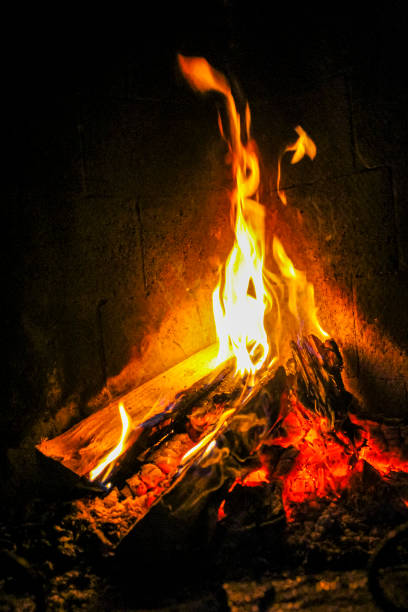 istock Romantic bright open fire on wood in a hut, Norway. 1276736614