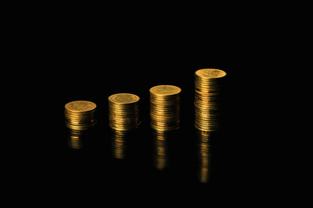 istock Gold coin on black background 1276737250