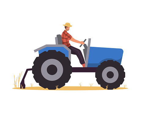 Farmer riding tractor in the field
