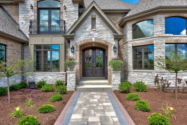 istock Grand front walkway of stone home 1276740255