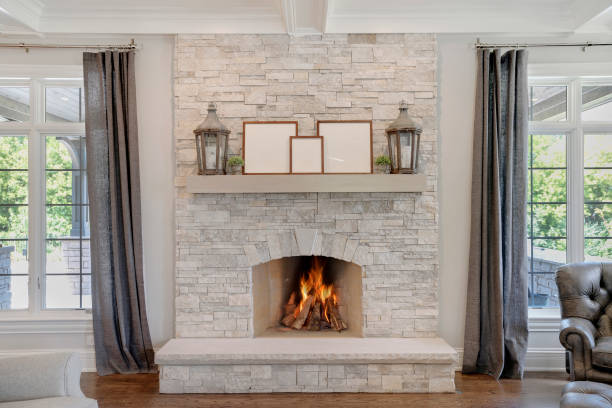 gorgeous stone fireplace with wood mantel - fire place imagens e fotografias de stock