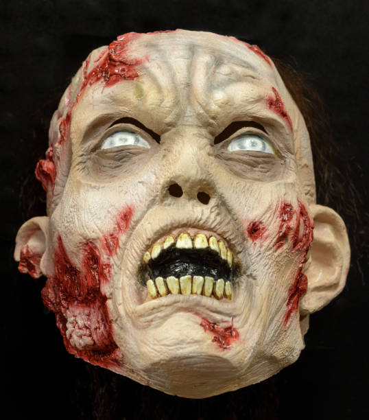 istock Undead Zombie Face Mask Isolated Against Black Background 1276741227