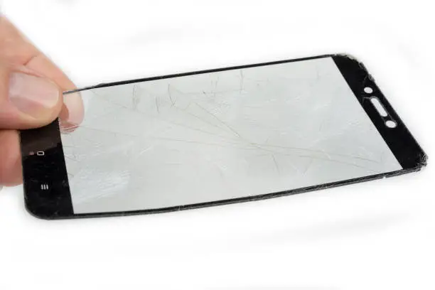Broken smartphone glass on a white background