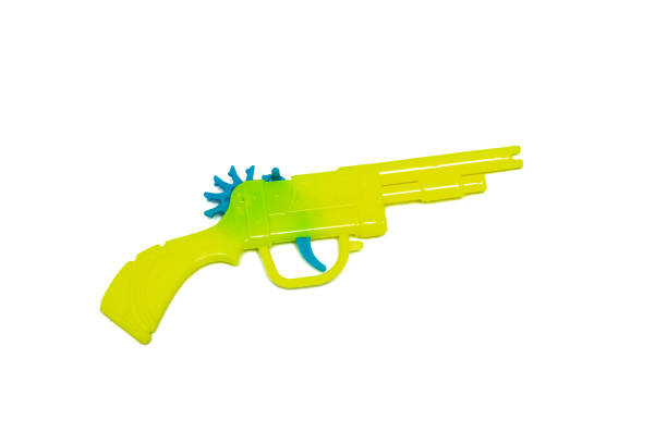 istock Toy yellow gun, isolated on white background 1276746088
