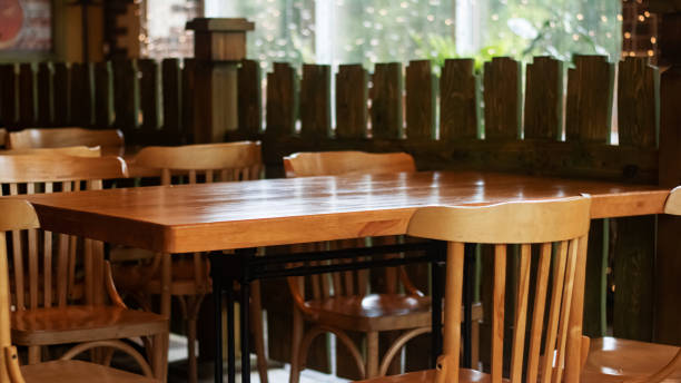 istock Wooden tables and chairs in a cafe 1276746183