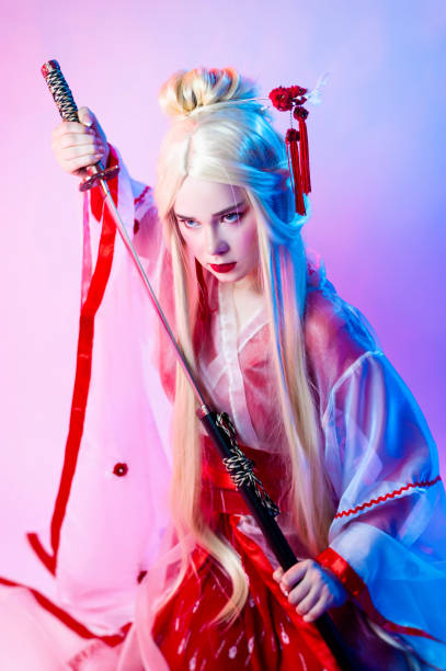 istock a woman dressed as a geisha with a katana 1276746225
