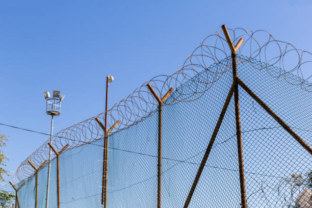 istock Barbed wire - strictly restricted area to prevent escape or invasion 1276746892