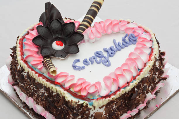 istock Closeup of cake top decoration with text congratulations 1276746977