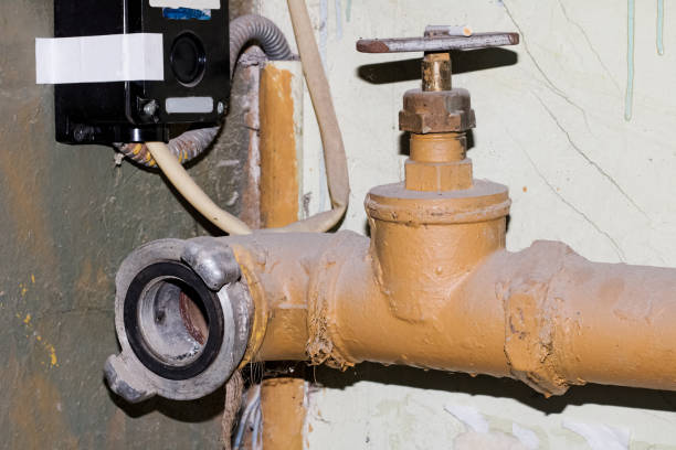 istock Old yellow metal pipe with valve lose up 1276747025