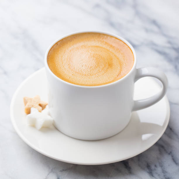 istock Coffee, espresso in white cup. Marble background. Close up. 1276749594
