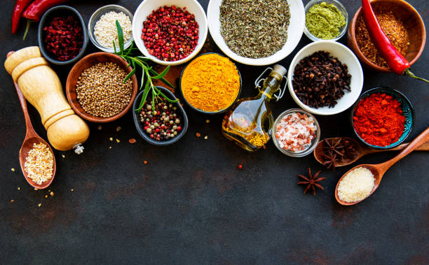 istock Assortment of spices on black 1276749619