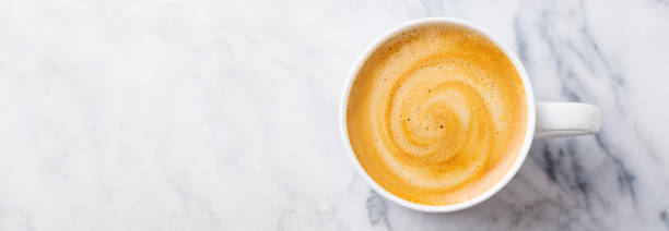 istock Coffee, espresso in white cup. Marble background. Copy space. Top view. 1276749636