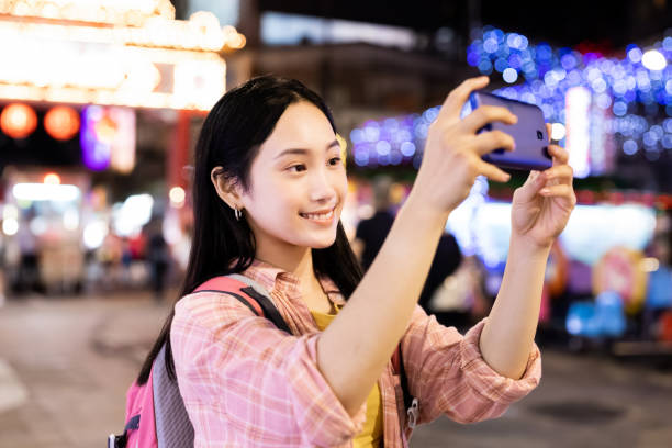 istock asian woman in night market 1276751621