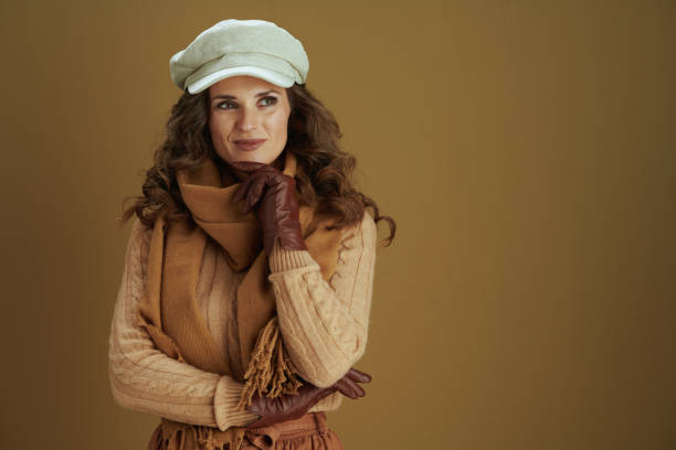 istock housewife looking at copy space isolated on beige background 1276752290