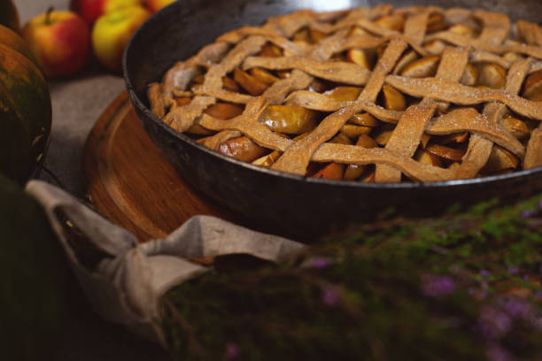 istock Preparation, Thanksgiving Day celebration. Baked apple pie on a baking sheet. Close-up. Making a traditional apple pie. 1276753298