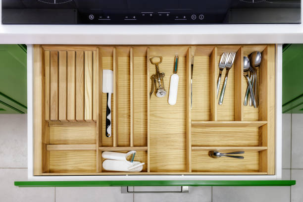 istock Kitchen furniture in green with open drawers 1276753917