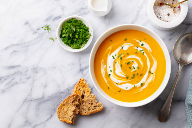 istock Pumpkin traditional soup with creamy silky texture. Marble background. Copy space. Top view. 1276756192