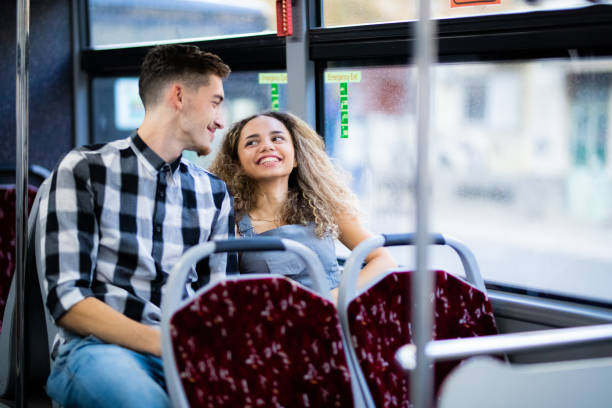 Young couple enjoys in public bus ride