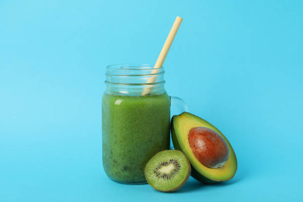 istock Smoothie, avocado and kiwi on blue background 1276762708