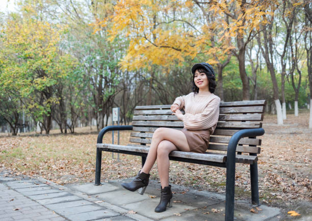 Beauty Girl Sitting on a Bench