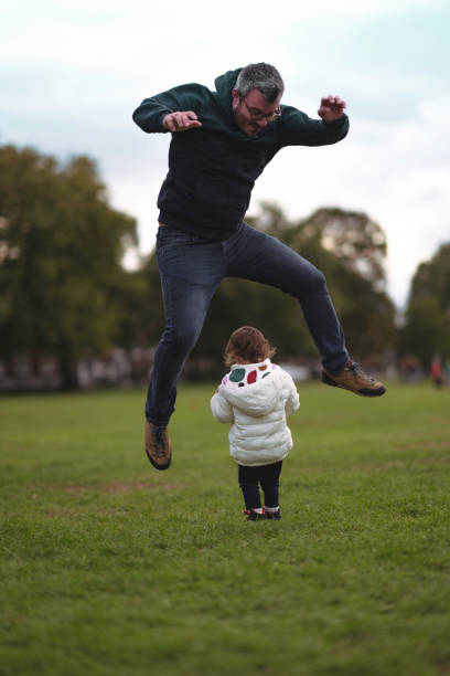 istock Father plays with his daughter in the park 1276763984