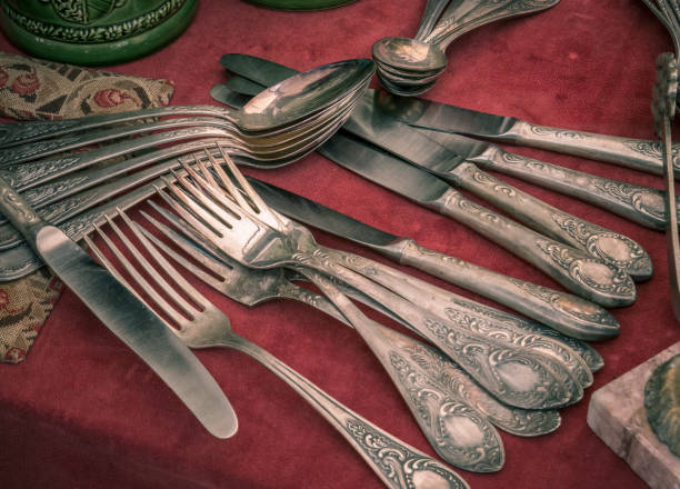 istock Old vintage cutlery on a red table. Vintage kitchen ustensils 1276764035