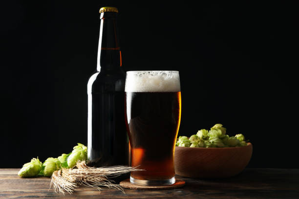 istock Beer, wheat and hop on wooden table 1276764811