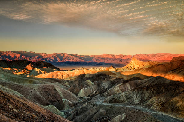 Zabriskie Point, sunrise, sun, golden path raod composed of sediments from Furnace Creek Lake, named after Christian Brevoort Zabriskie,Pacific Coast Borax Company,movie by Michelangelo Antonioni