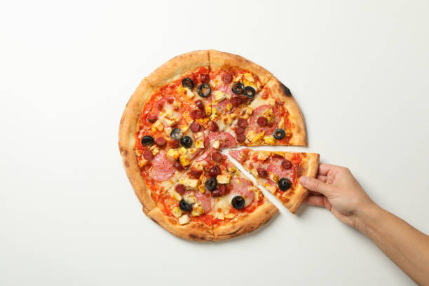 istock Female hand holds tasty pizza on white background 1276766171