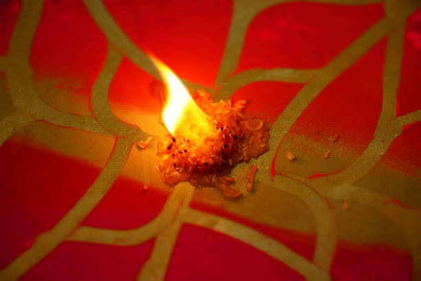 Fire Flame Diya with Red Rangoli stock photo