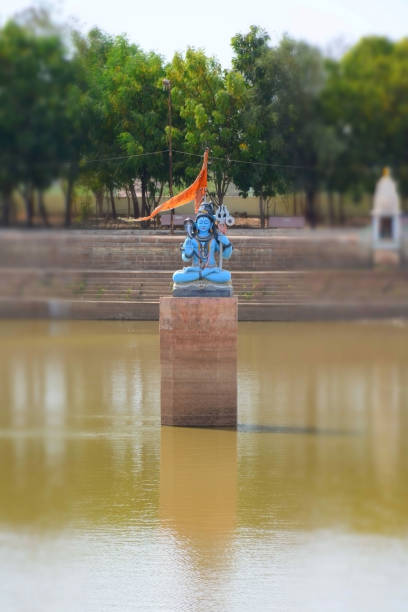 Lord Shiva in Blue Avatar in Center of the Lake Zoom View stock photo