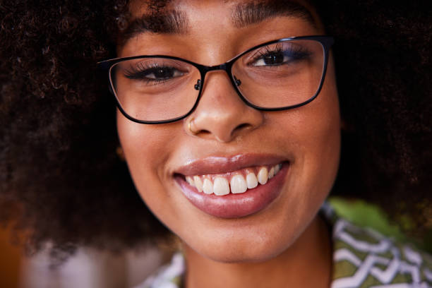 istock Young woman wearing glasses and smiling 1276776335