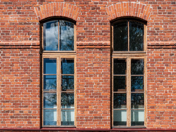 istock Beautiful high Windows in an old brick building. 1276777865